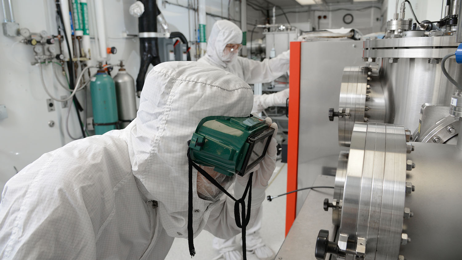 Graduate students work in the Microelectronics Research/Teaching laboratory at the Monteith Research Center on Centennial Campus, as part of the ASSIST center.